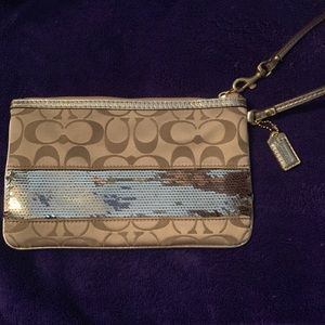 Large Coach wristlet with sequin details